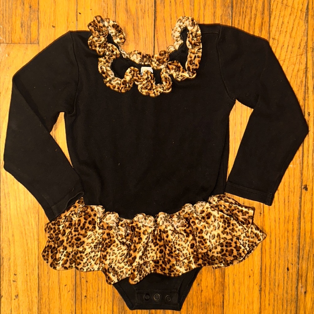 Leopard trim print onesie solid black.